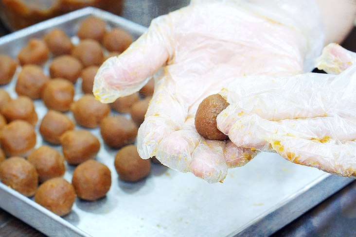 Rolling the filling for pineapple tarts by hand, the old fashioned way.