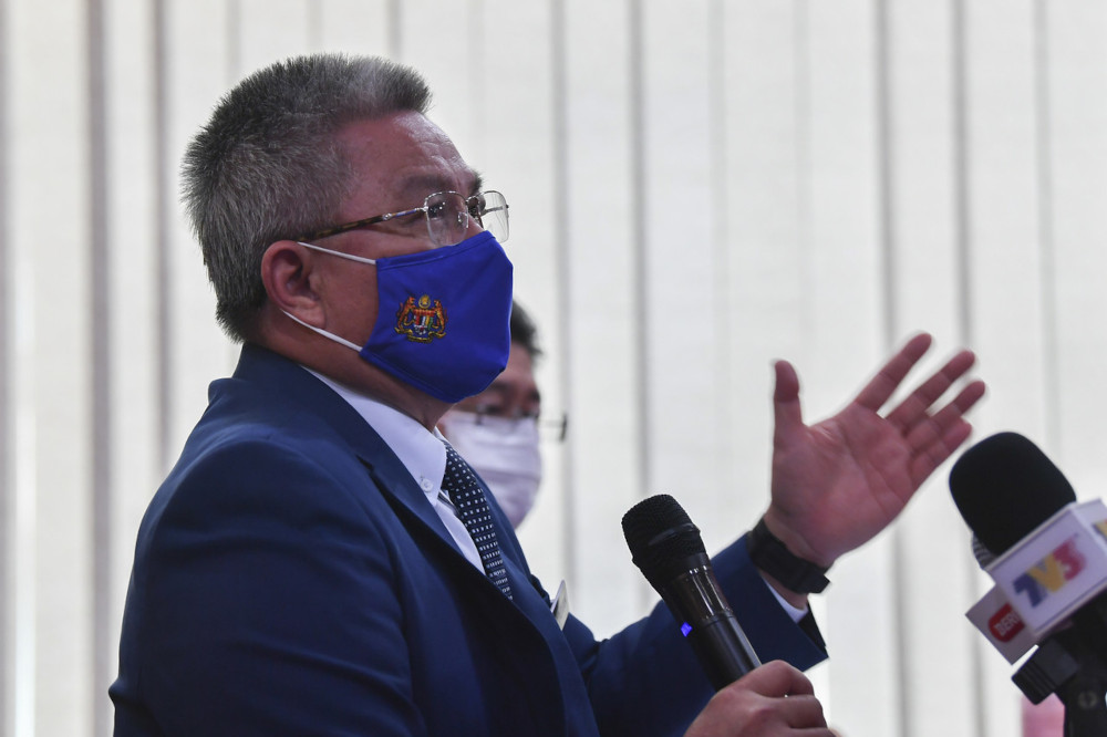 Health Minister Datuk Seri Dr Adham Baba speaks to the media after witnessing the signing of a note of cooperation between the Ministry of National Unity and the Ministry of Health in Putrajaya, March 31, 2021. u00e2u20acu201d Bernama pic 