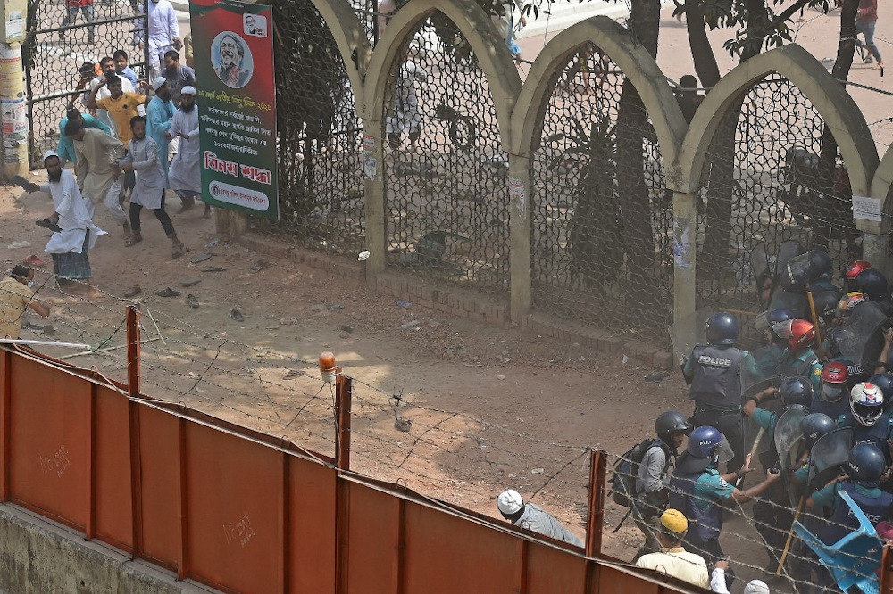 Activists from Islamist groups clash with the police as they protest against the visit of Indian Prime Minister Narendra Modi in Dhaka on March 26, 2021. u00e2u20acu201d AFP pic