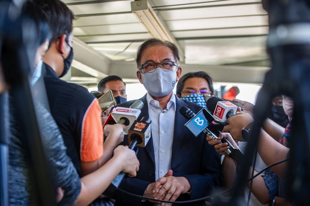 Datuk Seri Anwar Ibrahim speaks to members of the media at the MACC headquarters in Putrajaya March 22, 2021. u00e2u20acu201d Picture by Shafwan Zaidon