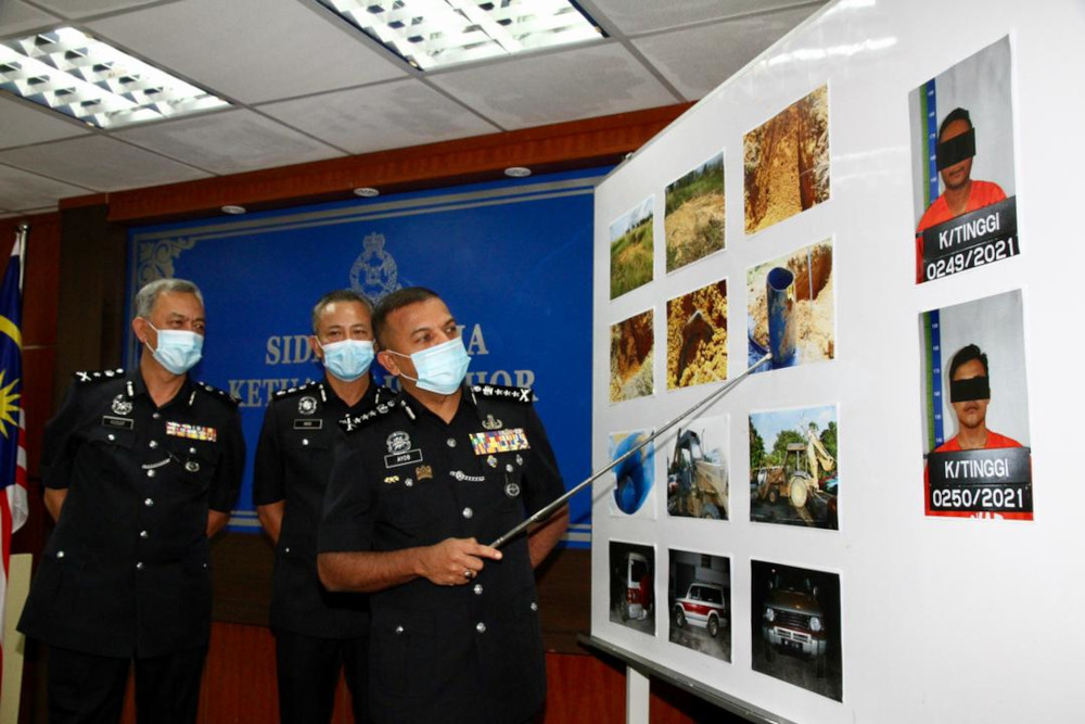 Johor police chief Datuk Ayob Khan Mydin Pitchay showing the makeshift burial area where investigators recovered the victim’s body in Bandar Penawar near Kota Tinggi. — Picture by Ben Tan