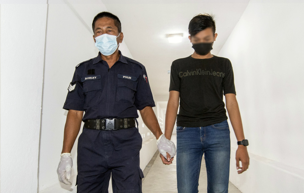 One of the teenage boys charged in the Magistratesu00e2u20acu2122 Court in Kota Baru, March 11, 2021. u00e2u20acu201d Bernama picn