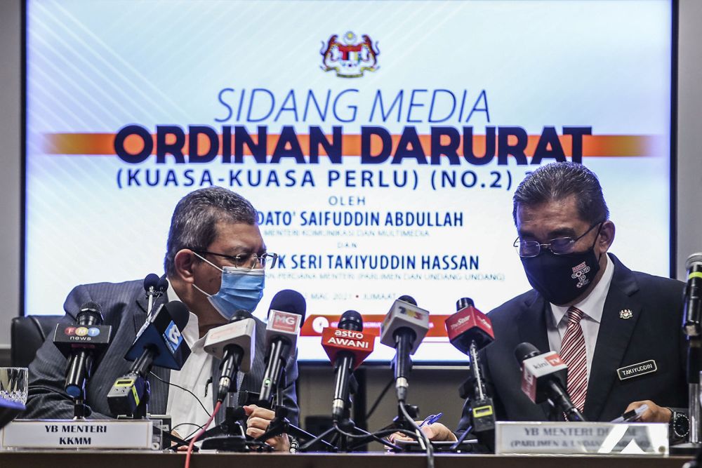 Communications and Multimedia Minister Datuk Saifuddin Abdullah and Law Minister Datuk Seri Takiyuddin Hassan are pictured during a press conference on the Emergency Ordinance in Putrajaya March 12, 2021.u00e2u20acu201d Picture by Hari Anggara