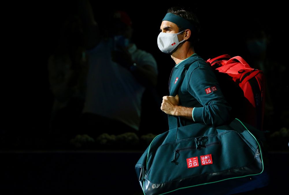 Switzerland's Roger Federer wearing a mask as he walks out before his first round match against Great Britain's Dan Evans at the Khalifa International Tennis and Squash Complex, Doha March 10, 2021. u00e2u20acu201d Reuters pic