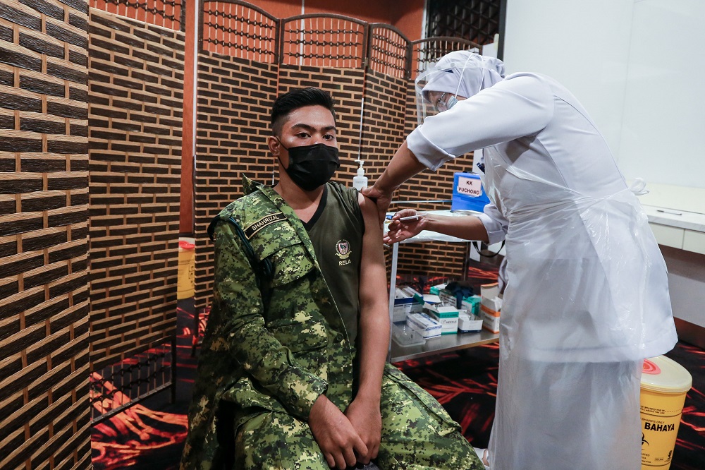 Frontliners receive the first dose of the Covid-19 Pfizer vaccine at the Sunway Pyramid Convention Centre March 11, 2021. u00e2u20acu2022 Picture by Ahmad Zamzahuri