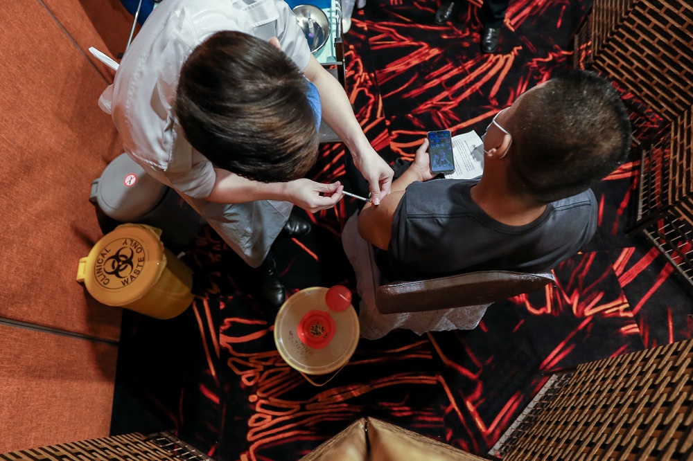 Frontliners receive the first dose of the Covid-19 Pfizer vaccine at the Sunway Pyramid Convention Centre March 11, 2021. u00e2u20acu2022 Picture by Ahmad Zamzahuri
