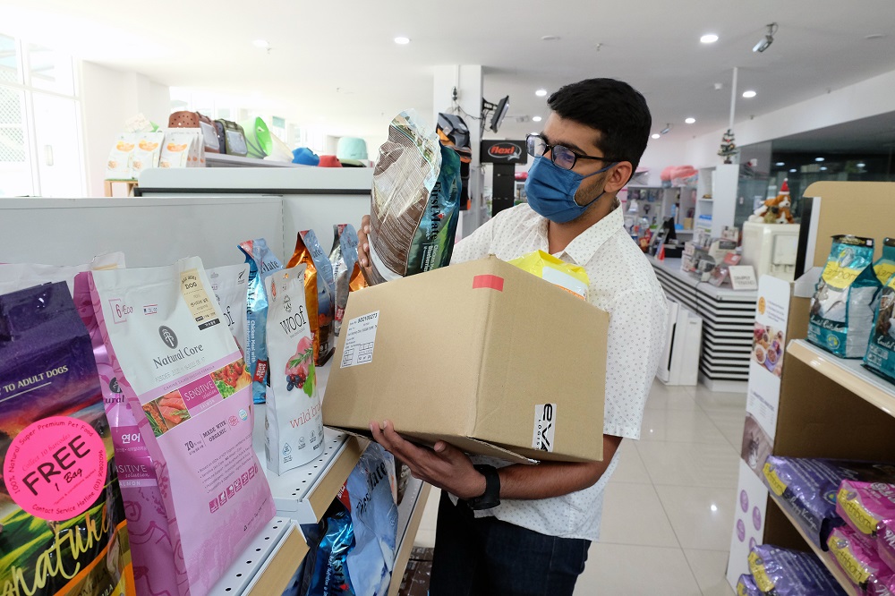 Dalbinder collects items ordered by customers to be sent to them. ― Picture by Steven KE Ooi