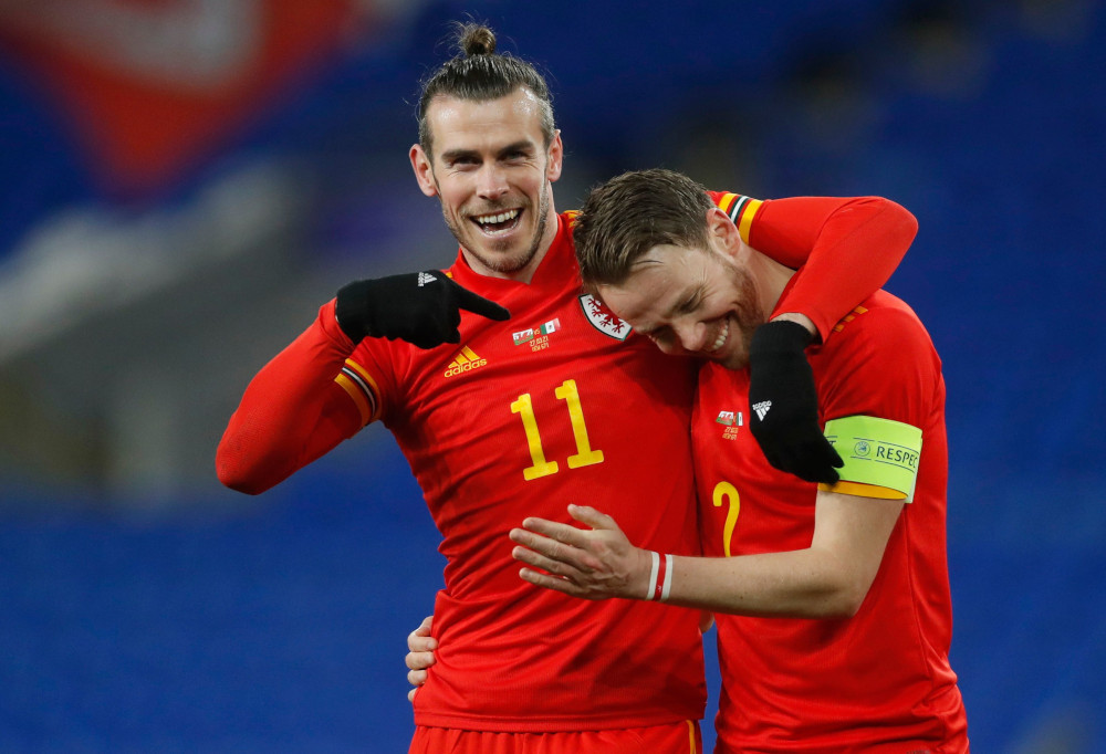 Walesu00e2u20acu2122 Gareth Bale and Chris Gunter celebrate after the match against Mexico at Cardiff City Stadium, Wales, March 27, 2021. u00e2u20acu201d Action Images via Reuters