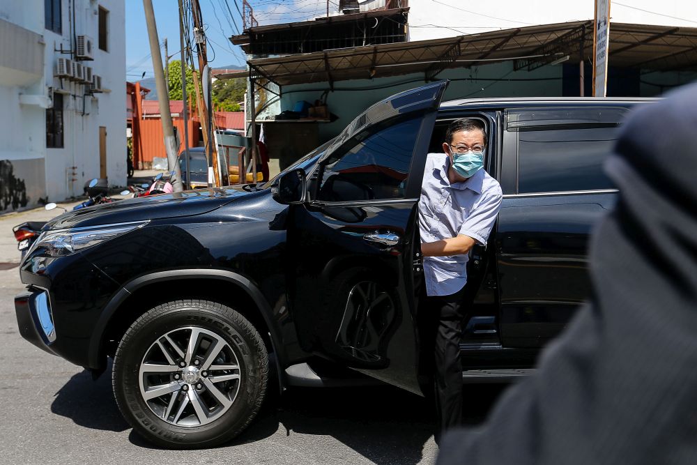 DAP secretary-general Lim Guan Eng arrives at the Northeast District Police Station in George Town March 11, 2021. u00e2u20acu201d Picture by Sayuti Zainudinnn