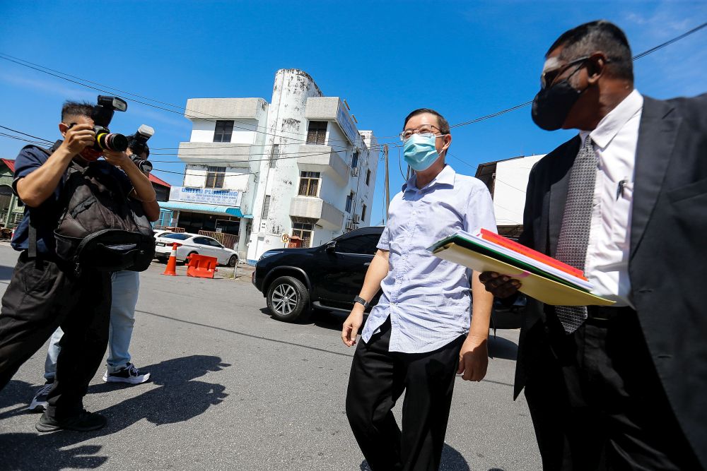DAP secretary-general Lim Guan Eng arriving at Northeast District Police Station in George Town March 11, 2021. u00e2u20acu201d Picture by Sayuti Zainudinnn