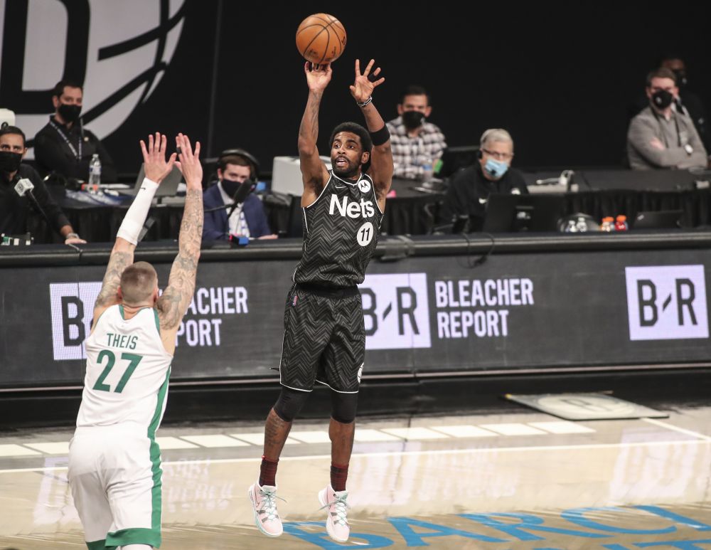 Brooklyn Nets guard Kyrie Irving (11) shoots a three point shot in the third quarter against the Boston Celtics at Barclays Centre, Brooklyn March 11, 2021.u00e2u20acu201d Reuters  pic