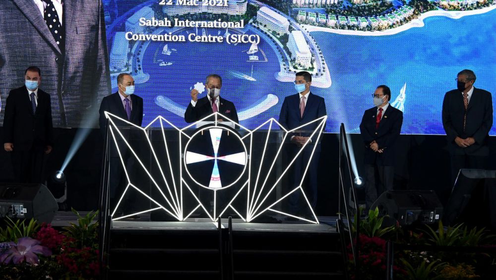 Prime Minister Tan Sri Muhyiddin Yassin (third from left) officiates the launch of the Lok Kawi Resort City development at the Sabah International Convention Centre March 22, 2021. u00e2u20acu201d Bernama pic