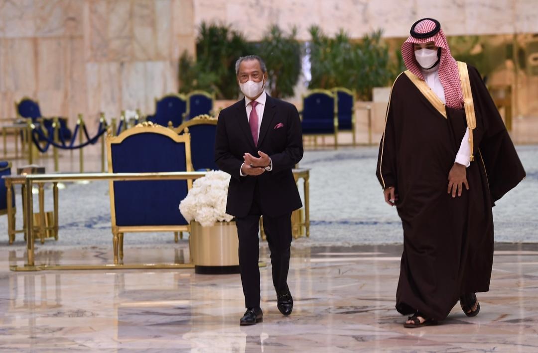 Malaysian Prime Minister Tan Sri Muhyiddin Yassin is pictured with Saudi Crown Prince Mohammed bin Salman at the Al-Yamamah Palacein Riyadh March 9, 2021. u00e2u20acu201d Picture via Facebook