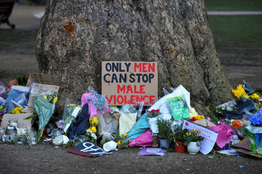 Signs and flowers are left under a tree near the Clapham Common Bandstand, following the kidnap and murder of Sarah Everard, in London March 17, 2021. u00e2u20acu201d Reuters pic