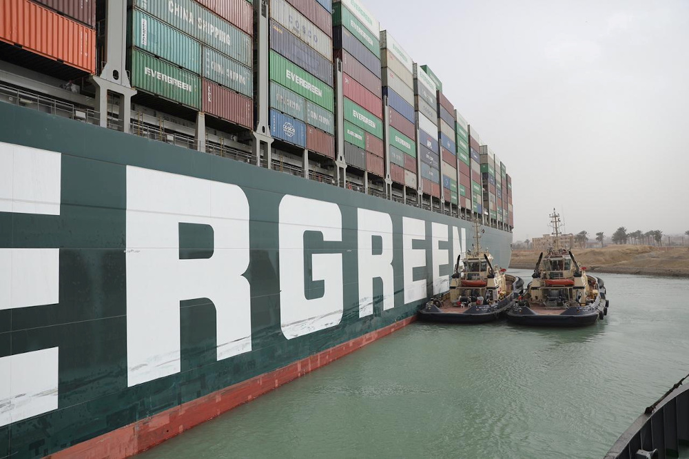 Stranded container ship Ever Given, one of the world's largest container ships, is seen after it ran aground, in Suez Canal March 25, 2021. u00e2u20acu201d Suez Canal Authority handout pic via Reuters