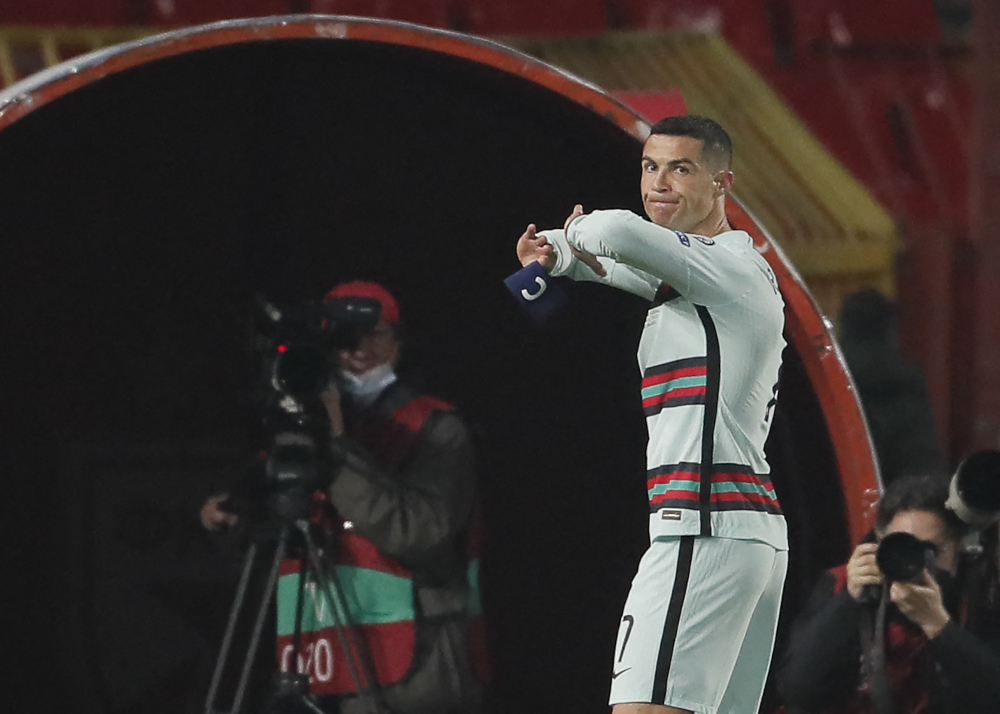 Cristiano Ronaldo holds his captain armband moments before he threw it to the ground and left the pitch at the end of the Fifa World Cup Qatar 2022 qualification football match between Serbia and Portugal at the Rajko Mitic Stadium, in Belgrade, March 27,
