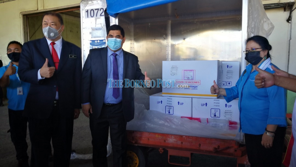 (From left) Lee, Shahelmey and Dr Christina when receiving the vaccine at Mas Kargo today. u00e2u20acu201d Borneo Post Online picn