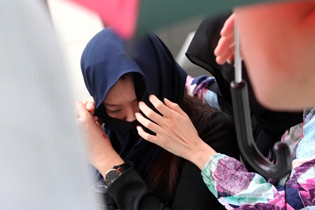 Ong Si Mien seen leaving the State Courts on March 4, 2021. She struck her Indonesian domestic worker on the head with a metal bowl and cordless phone, and also slapped her. u00e2u20acu201d TODAY pic