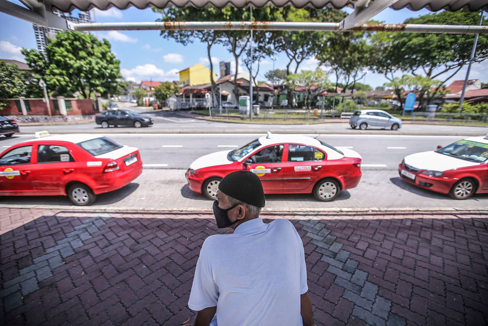 Cab driver Ornomo Saripin, 65, said that his number of customers has increased very slowly in the last two weeks, but that MCO 2.0 made little difference to him as most prefer to use e-hailing services anyway March 4, 2021. u00e2u20acu2022 Picture by Hari Anggaran