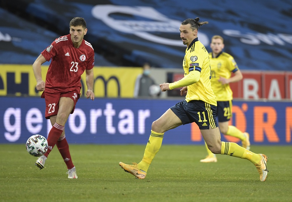 Sweden's Zlatan Ibrahimovic in action with Georgia's Lasha Dvali March 26, 2021. u00e2u20acu2022 Handout via Reuters 