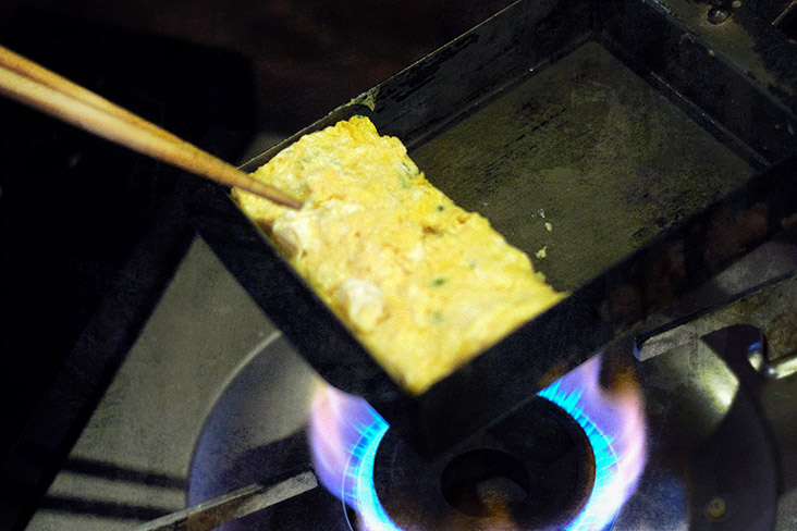 Keep rolling the omelette until it has flipped onto itself into a block.