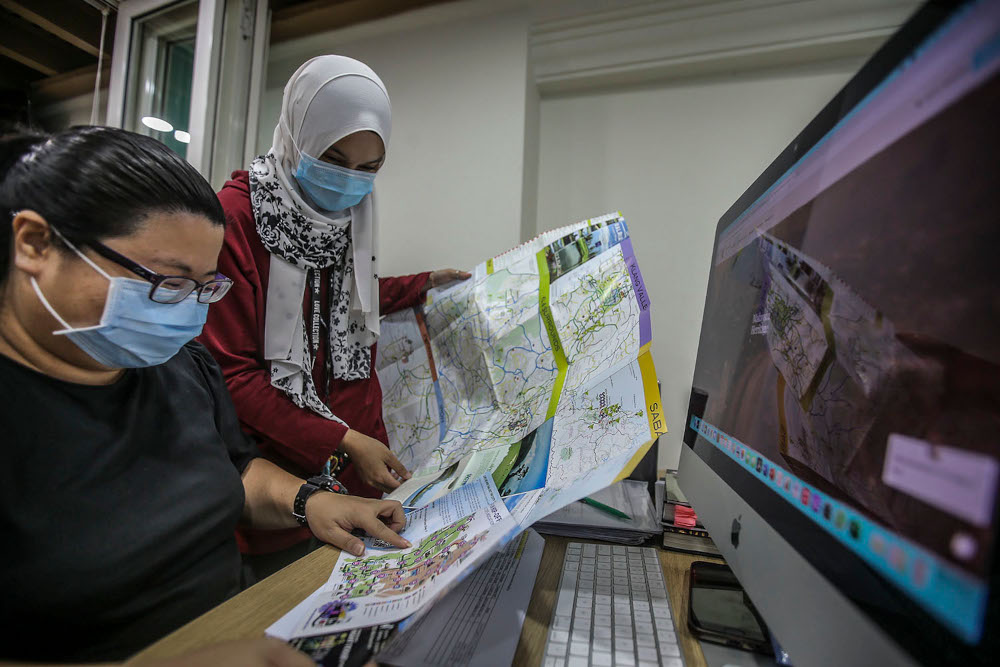 A general shot of travel agency employees managing customer bookings online during a survey at the Tourist Information and Interaction Centre in Kuala Lumpur, March 11, 2021. u00e2u20acu2022 Picture by Hari Anggara