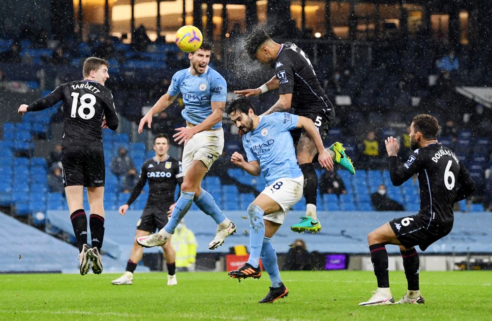 Aston Villa's Tyrone Mings in action with Manchester City's Ruben Dias and Ilkay Gundogan at the Etihad Stadium January 20, 2021. u00e2u20acu201d Reuters picnn