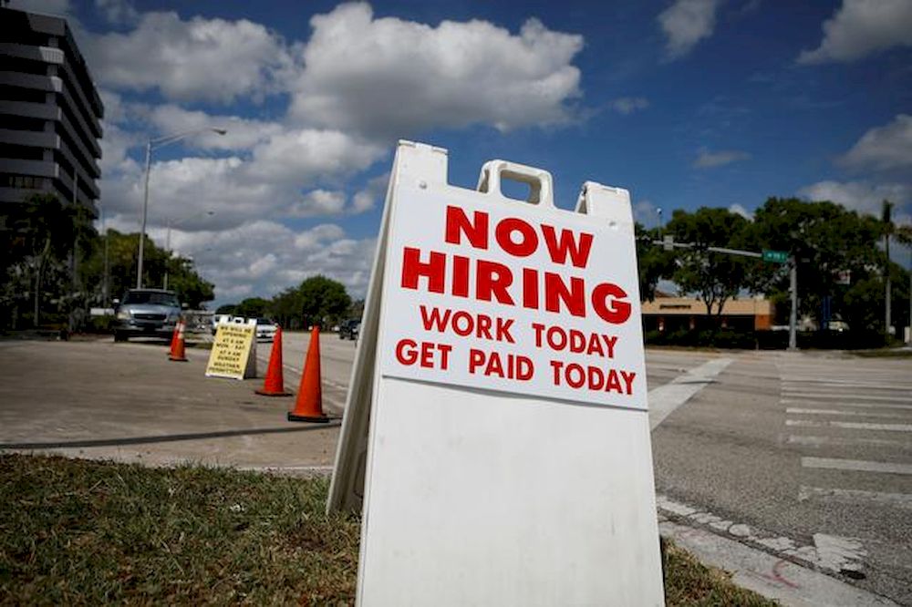 A u00e2u20acu02dcNow Hiringu00e2u20acu2122 sign advertising jobs at a hand car wash is seen along a street, as the spread of the coronavirus disease (Covid-19) continues, in Miami, Florida, US, May 8, 2020. u00e2u20acu201d Reuters pic