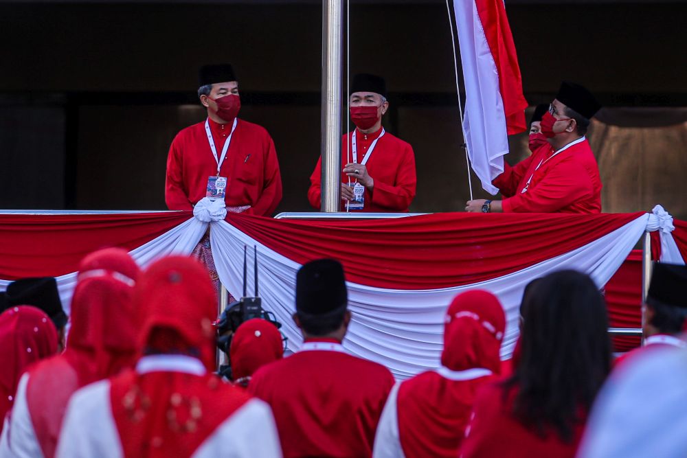 Umno president Datuk Seri Ahmad Zahid Hamidi raises the party flag at the World Trade Centre Kuala Lumpur March 28, 2021. u00e2u20acu201d Picture by Hari Anggara