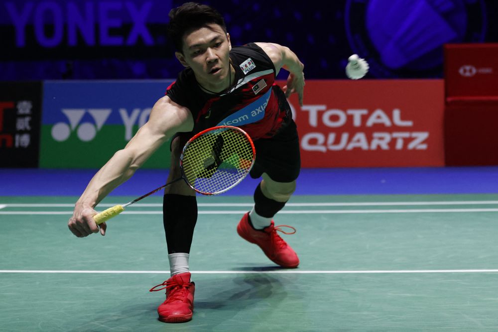 Lee Zii Jia in action against Kento Momota during the men's singles quarter-final match at the All England Open Badminton Championship in Birmingham March 19, 2021.  u00e2u20acu2022 AFP picnn