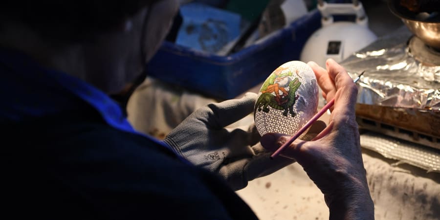 Tunde Csuhaj, creator of artfully decorated Easter eggs, works on a goose egg at her workroom in the town of Szekszard, Hungary. u00e2u20acu201d AFP pic