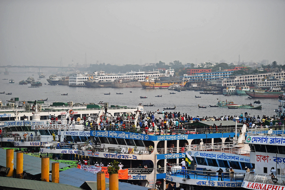 People cram on ferries to travel back to their homes as the government will impose a lockdown from April 5 as a preventive measure against Covid-19 in Dhaka April 4, 2021. u00e2u20acu201d AFP pic
