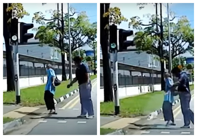 A kind Singaporean lorry driver stopped his lorry at the zebra crossing to help the senior citizen cross the road. u00e2u20acu201d Screengrab via Youtube/theonlinecitizentoc