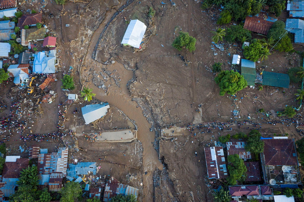 An aerial view shows damaged houses following flash floods triggered by a tropical cyclone in East Flores, East Nusa Tenggara province, Indonesia April 6, 2021. u00e2u20acu201d Antara Foto/Aditya Pradana Putra/via Reuters