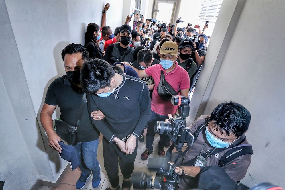 Fourteen members of the Nicky Gang at the Sessions Court in Petaling Jaya April 9, 2021. u00e2u20acu201d Picture by Ahmad Zamzahuri