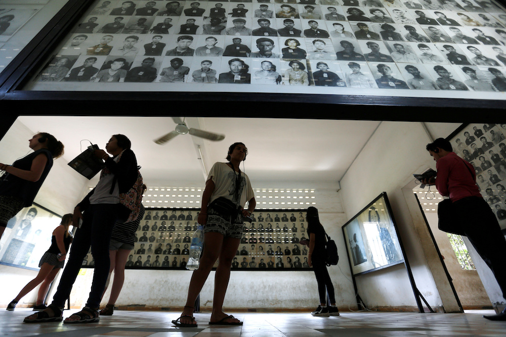 A visitor looks at pictures of victims of the Khmer Rouge regime at Tuol Sleng Genocide Museum in Phnom Penh, Cambodia June 1, 2016. u00e2u20acu201d Reuters pic