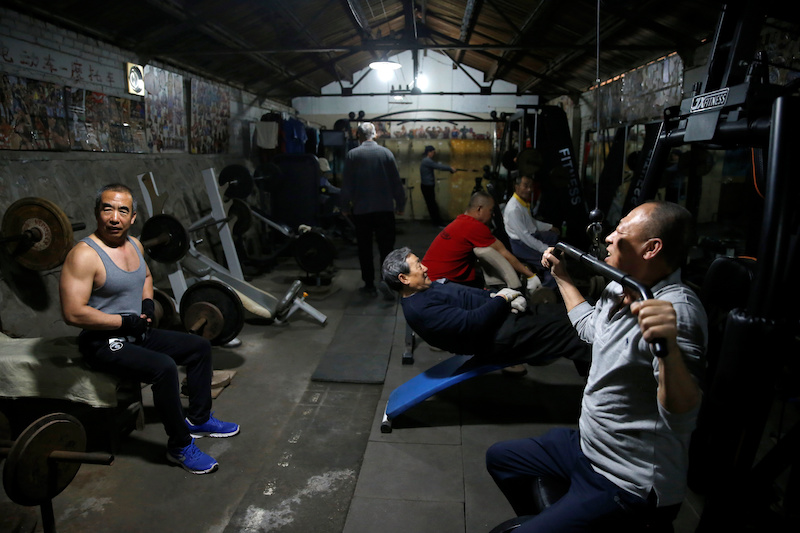 Men work out at a gym which has been turned from a bicycle shed inside a residential compound in the southwest of Beijing, China April 8, 2021. u00e2u20acu201d Reuters pic