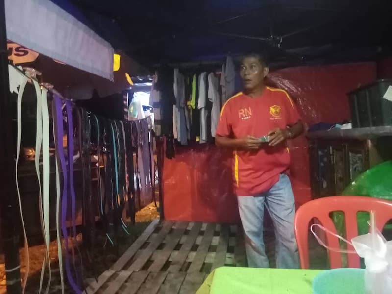 Japeridin manning the 'Bundle Percuma' tent. — Picture courtesy of Japeridin Sampol