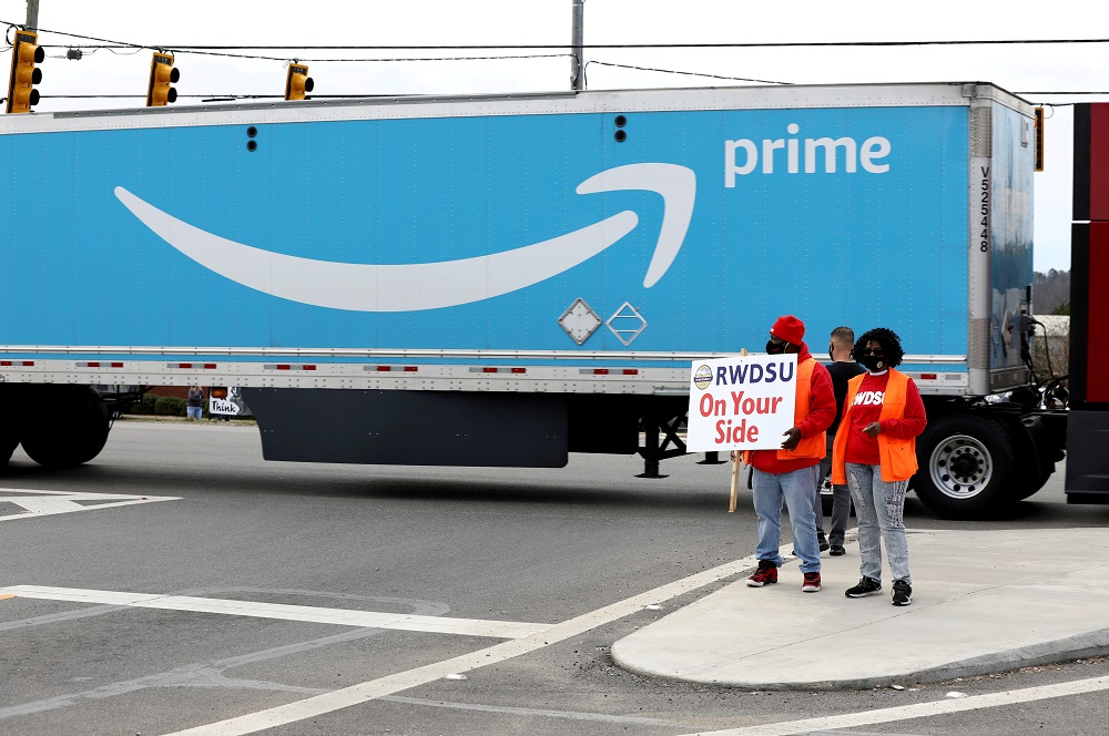 People hold a banner at the Amazon facility as members of a congressional delegation arrive to show their support for workers who will vote on whether to unionize, in Bessemer, Alabama March 5, 2021. u00e2u20acu201d Reuters pic