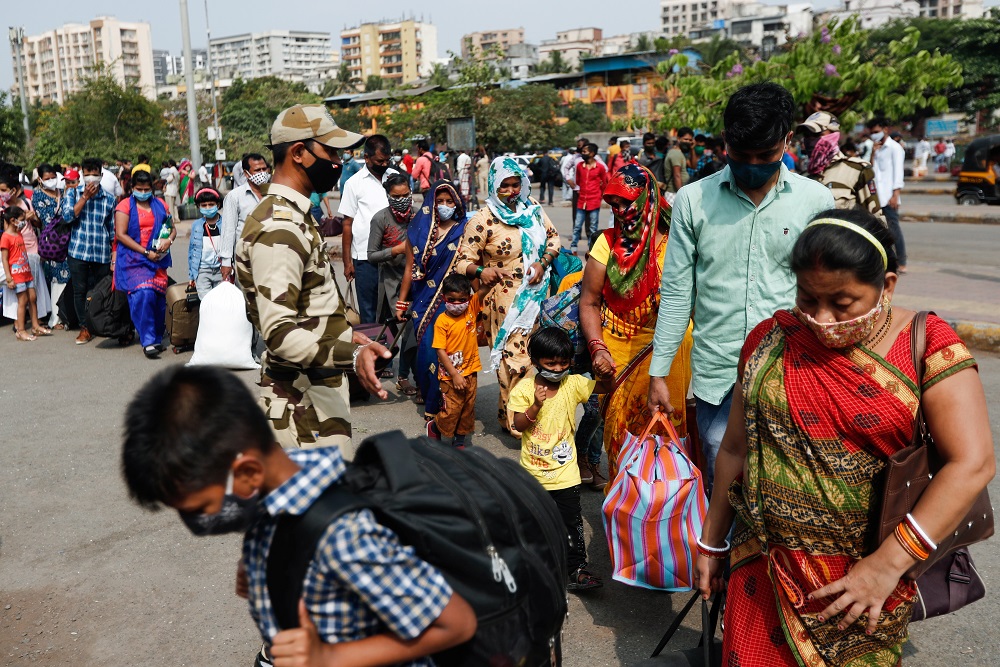 People wearing protective masks walk in a line at a railway station amidst the spread of the coronavirus disease in Mumbai 9 April, 2021. u00e2u20acu201d Reuters pic