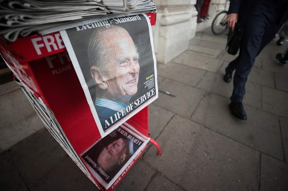 A picture of Britainu00e2u20acu2122s Prince Philip, husband of Queen Elizabeth, is seen on the front page of newspapers, after he died at the age of 99, in London April 9, 2021. u00e2u20acu201d Reuters pic