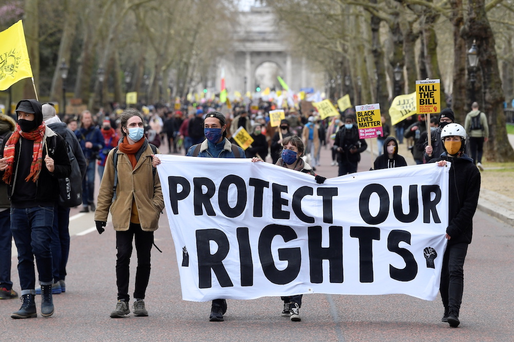 Demonstrators hold a placard during a protest in London, Britain, April 3, 2021. u00e2u20acu201d Reuters pic