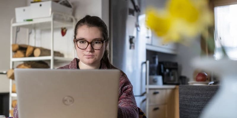 Polish teen Krysia Paszko, creator of a website supporting domestic violence victims, works on a computer in her family house in a suburb of Warsaw. u00e2u20acu201d AFP pic