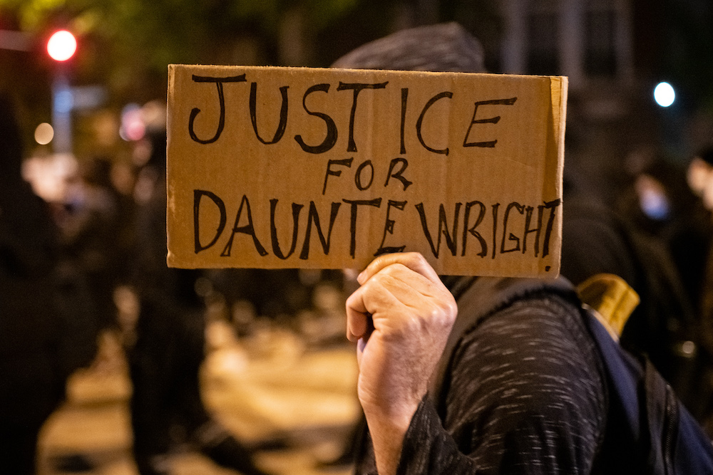 A demonstrator holds a sign that reads u00e2u20acu02dcJustice for Daunte Wrightu00e2u20acu2122 during a protest in Washington, D.C.,April 12, 2021. u00e2u20acu201d Reuters picn n