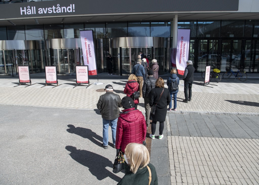 People queue to get a vaccine against the Covid-19 outside the Stockhomsmassan exhibition center turned mass vaccination center in Stockholm, Sweden, on April 8, 2021. u00e2u20acu201d AFP picnn