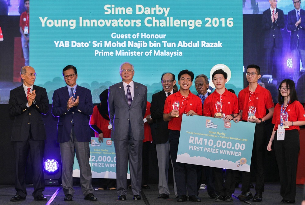 Ivan (second right) and his team created the prototype of the first-ever surplus food app known as Robin Food. — Picture by Ivan Avannus Jacob Jimbangan 