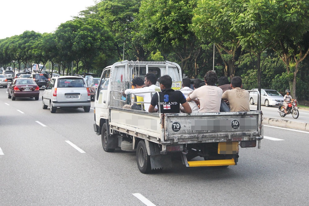 A file photo of migrant workers being transported in the back of a lorry in 2010. u00e2u20acu201d TODAY pic