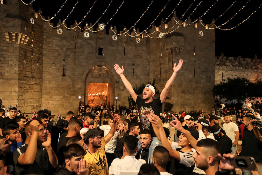 Palestinians celebrate outside Damascus Gate after barriers that were put up by Israeli police are removed, allowing them to access the main square that has been the focus of a week of clashes around Jerusalem's Old City April 25, 2021. u00e2u20acu201d Reuters pic