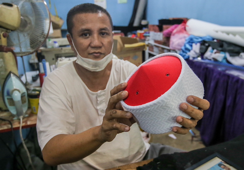 Songkok maker Hamzah Irzal said he learn the skill of making songkok from a songkok supplier at Mak Mandin, Butterworth. — Picture by Farhan Najib