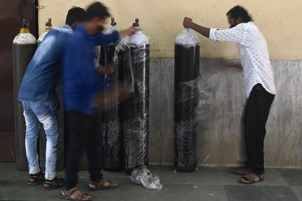 Staff unwrap oxygen cylinders at a newly set up Covid-19 coronavirus care centre in Mumbai April 26, 2021. u00e2u20acu201d AFP pic